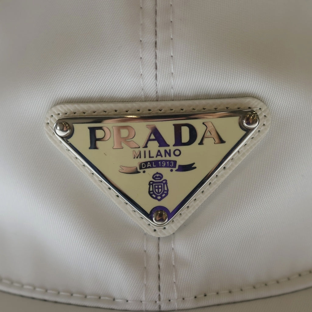 PRADA(プラダ) NERO TESSUTO CAPELLI ナイロン 三角プレート 2HC231 キャップ ホワイト レディース