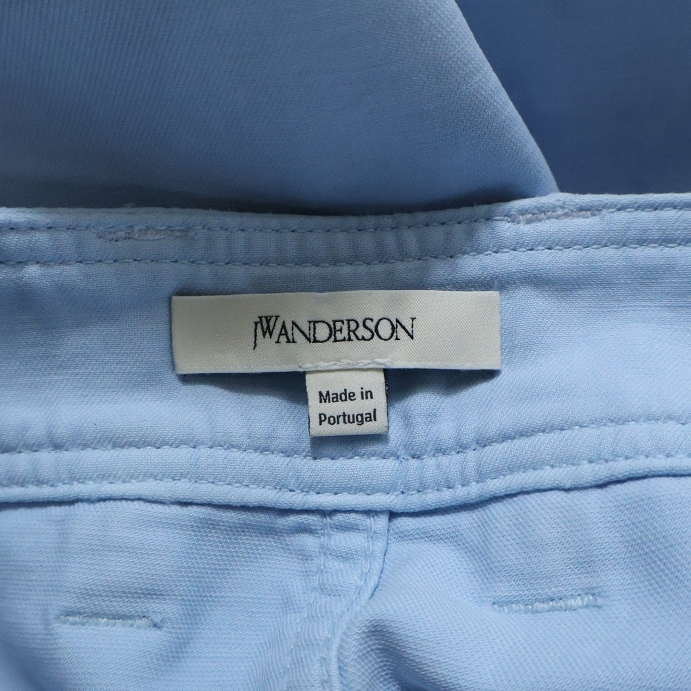 J.W.ANDERSON(ジェー ダブリュー アンダーソン) TWISTED SEAM TROUSERS ポケットロゴ ツイスト トラウザーパンツ ブルー TR0417PG1600806