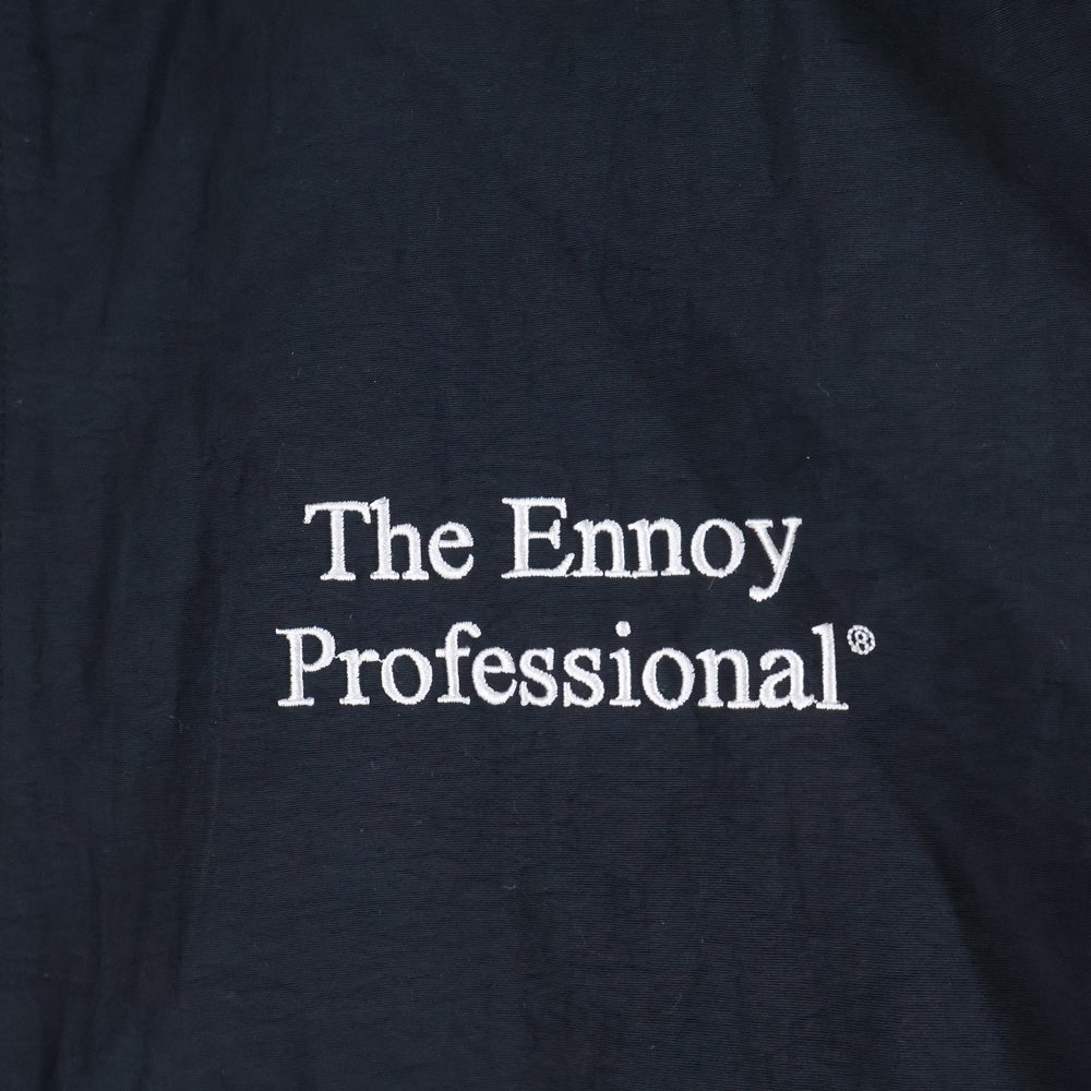 The Ennoy Professional(エンノイプロフェッショナル) 23AW NYLON TRUCK SUIT JACKET ロゴ刺繍 ジップアップ トラックスーツ ブラック AW23BRENJK02LP