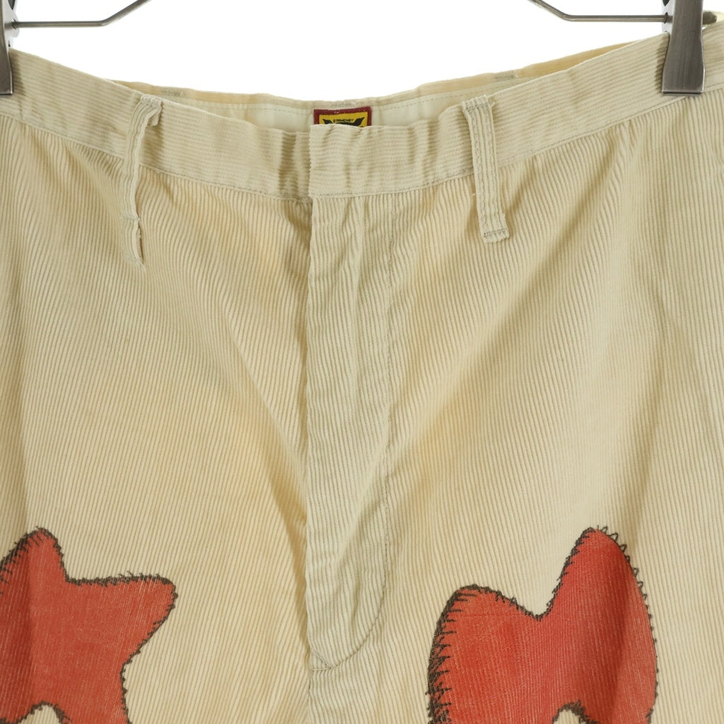 HUMAN MADE(ヒューマンメイド) ×KAWS CORDUROY PRINT PANTS カウズ ロゴプリント コーデュロイパンツ ベージュ