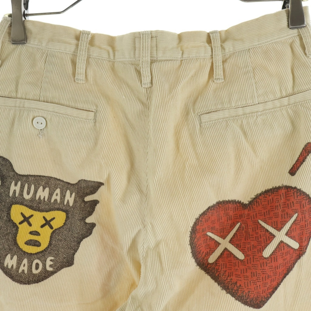 HUMAN MADE(ヒューマンメイド) ×KAWS CORDUROY PRINT PANTS カウズ ロゴプリント コーデュロイパンツ ベージュ