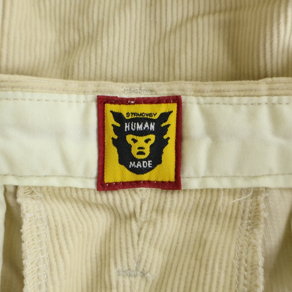 HUMAN MADE(ヒューマンメイド) ×KAWS CORDUROY PRINT PANTS カウズ ロゴプリント コーデュロイパンツ ベージュ