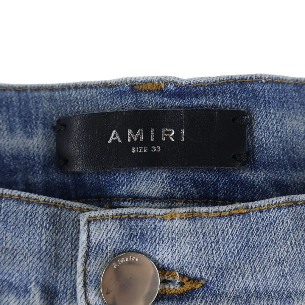 AMIRI(アミリ) ダメージ ペイント加工 ボタンフライ スキニーデニムパンツ インディゴ