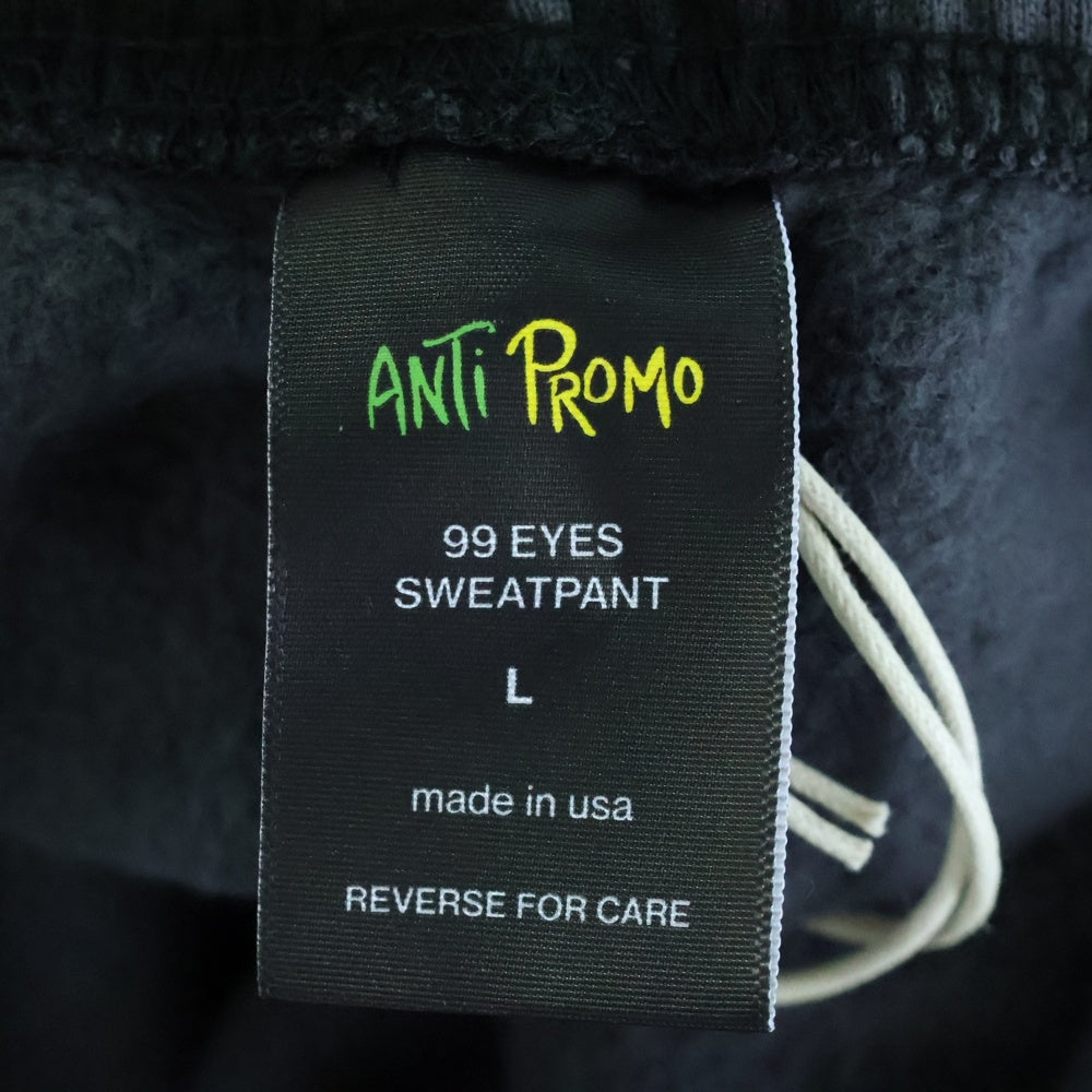 ANTI PROMO(アンチプロモ) 99EYES SWATPANTS MATTY BOY プリントスウェットロングパンツ ブラック