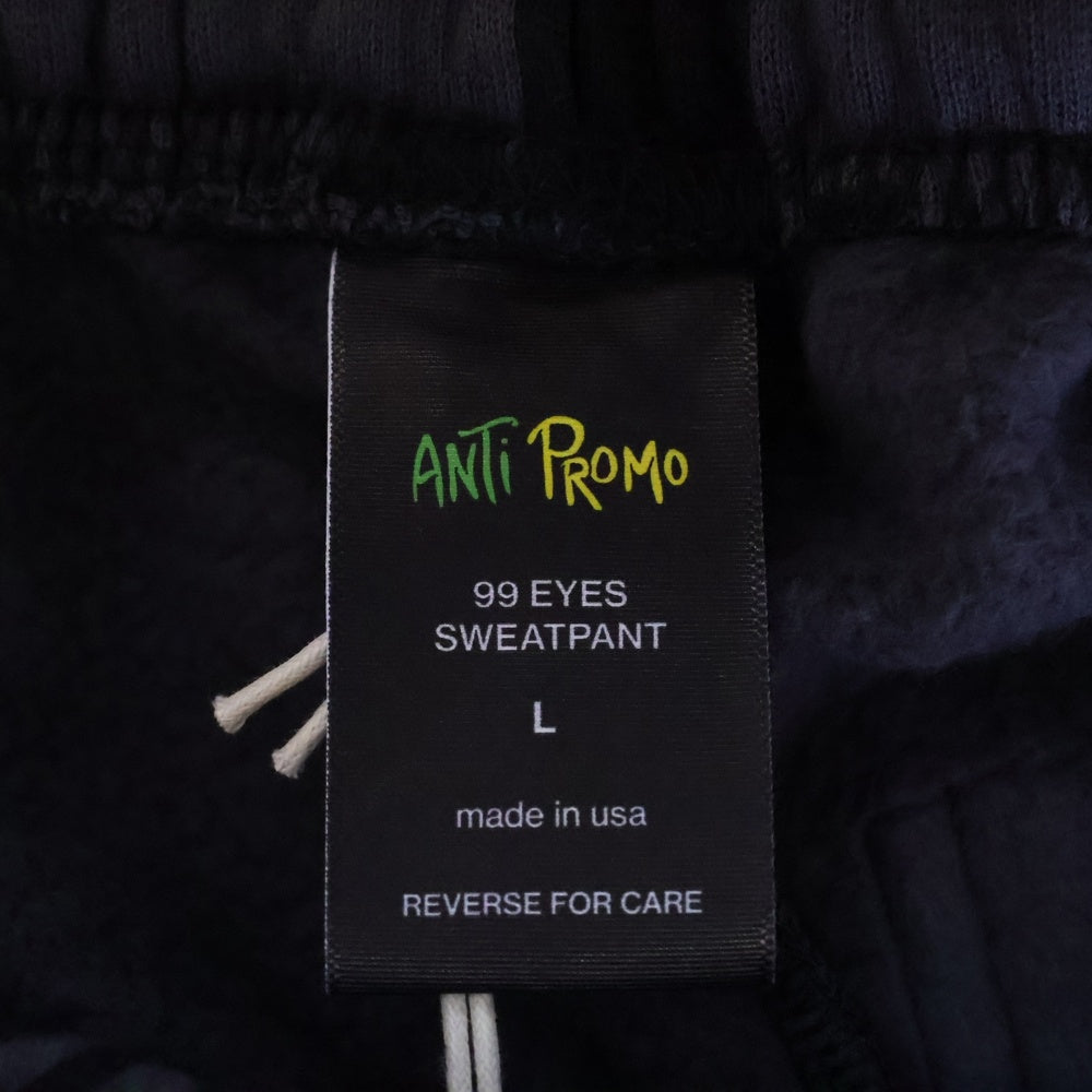 ANTI PROMO(アンチプロモ) 99EYES SWATPANTS MATTY BOY プリントスウェットロングパンツ ブラック