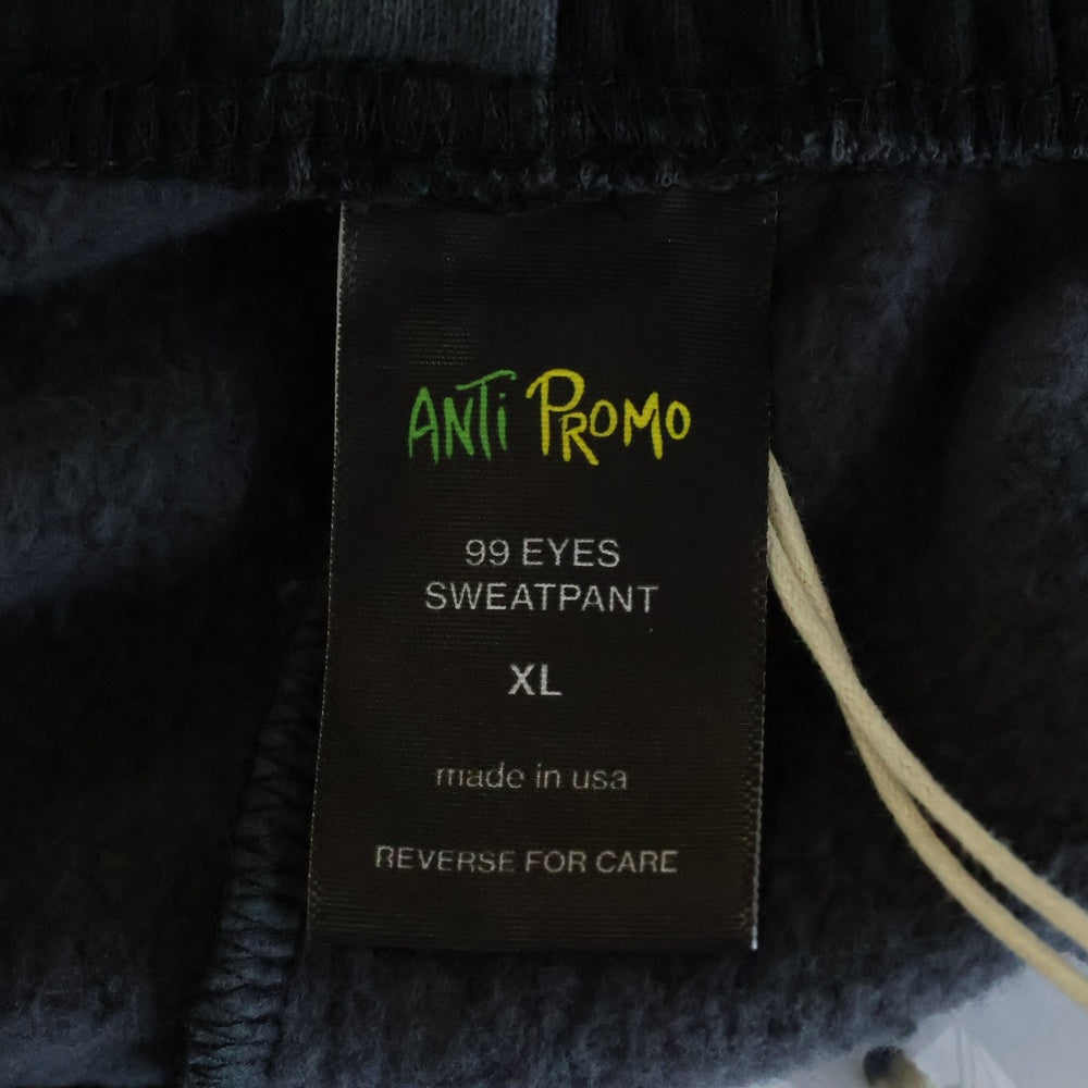 ANTI PROMO(アンチプロモ) 99EYES SWATPANTS MATTY BOY プリントスウェットロングパンツ ブラック