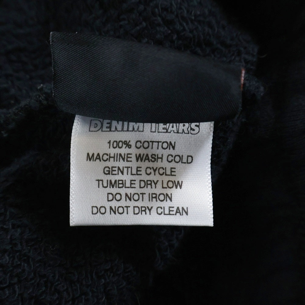 DENIM TEARS(デニムティアーズ) COTTON PEACE SWEAT PANTS コットンピースロゴスウェットパンツ ブラック