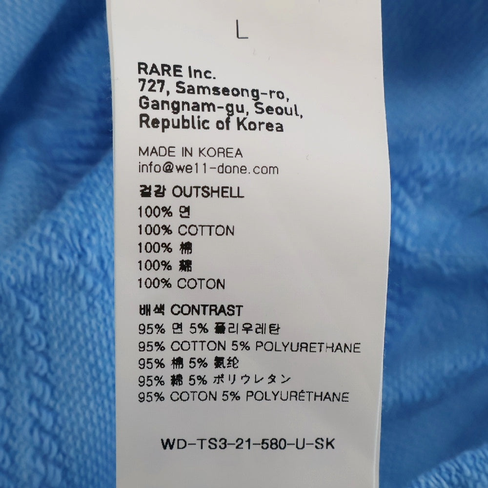 we11done(ウェルダン) 総柄クルーネック ロゴ長袖スウェットカットソー トレーナー ブルー WD-TS3-21-580-U-SK