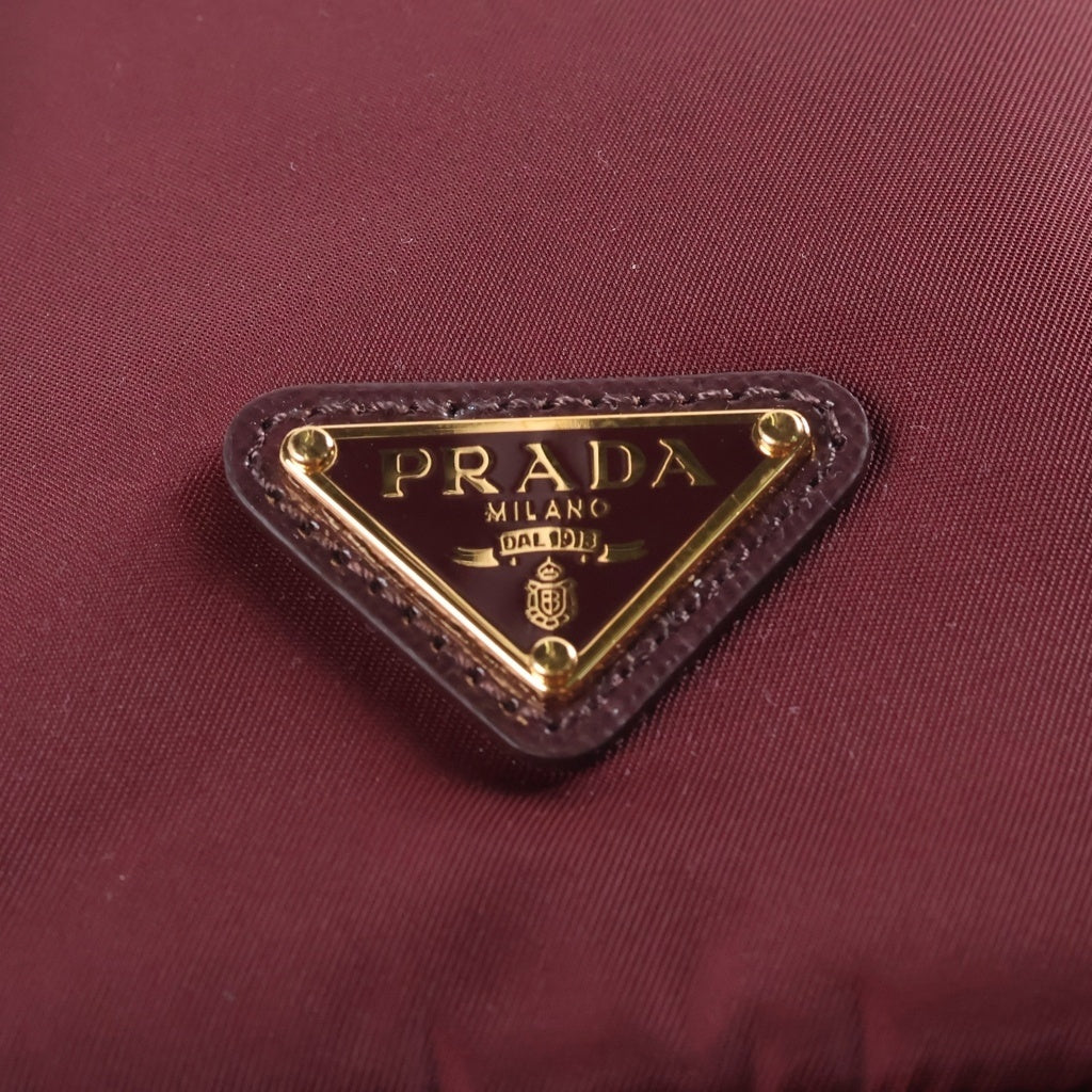PRADA(プラダ) Re-Nylon トライアングルロゴ 巾着ポーチ ミニバッグ ボルドー ワインレッド レザー×ナイロン 1NS369 ゴールド金具 レディース