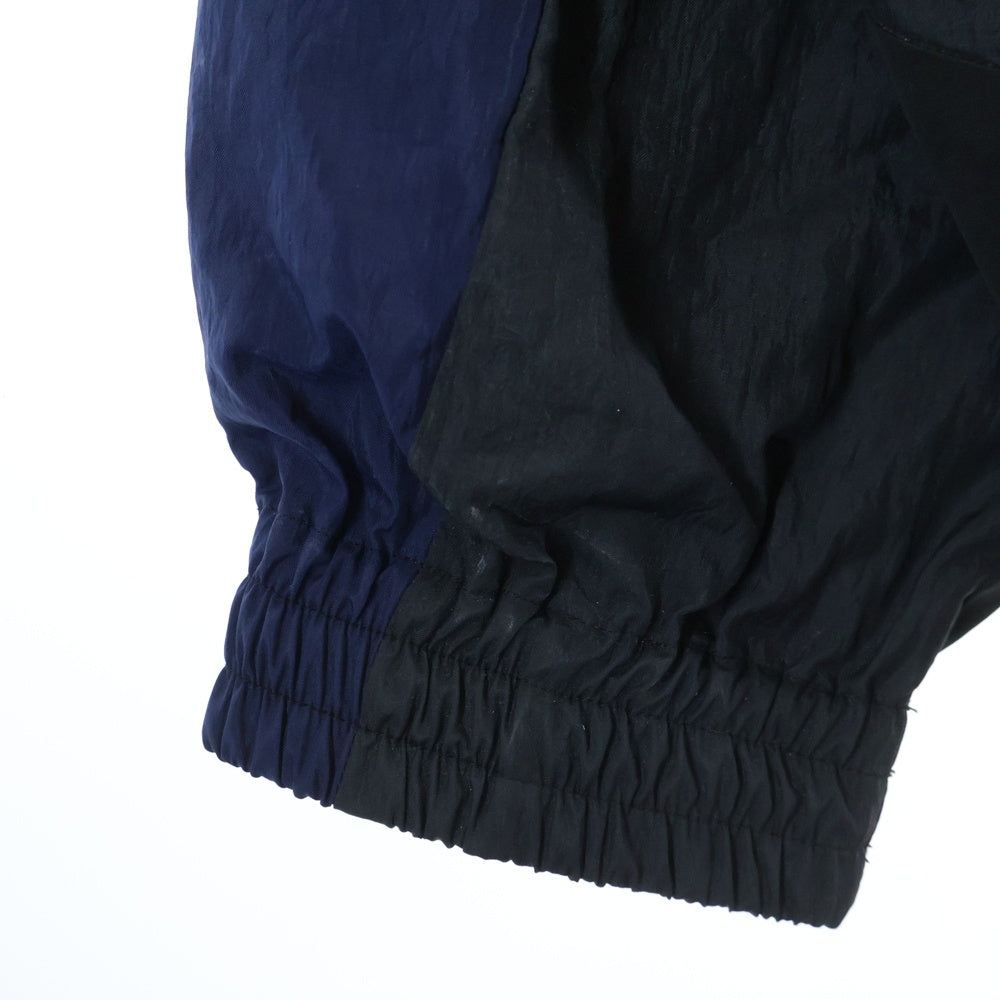 FACETASM(ファセッタズム) 23SS NYLON PATCHWORK JACKET パッチワーク フロントロゴ刺繍 ジップアップ ナイロンジャケット ブラック/ネイビー MKS-JK-M09