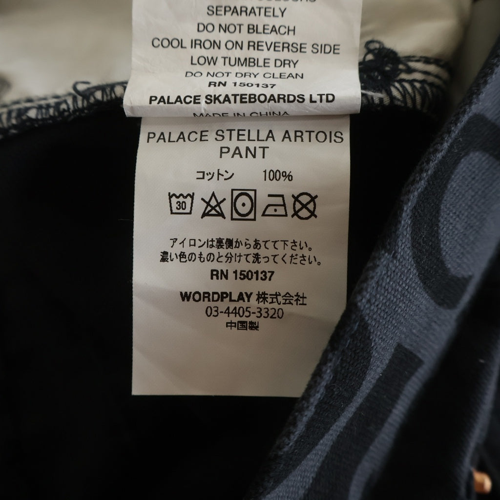 Palace Skateboards(パレススケートボーズ) x Stella Artois Logo Printed Casual Pants ロゴプリント カジュアルパンツ グレー