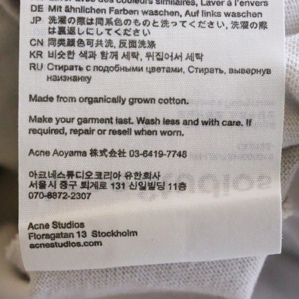 Acne Studios(アクネ ストゥディオズ) 3ボタン エンボスロゴ 長袖ポロシャツ FN-UX-TSHI000015 ホワイト