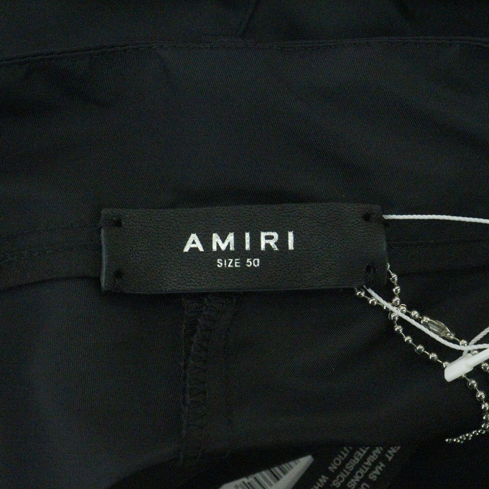 AMIRI(アミリ) PARACHUTE PANTS フロントロゴ刺繍 ナイロン ワイド パラシュートパンツ ブラック PF22MPF006