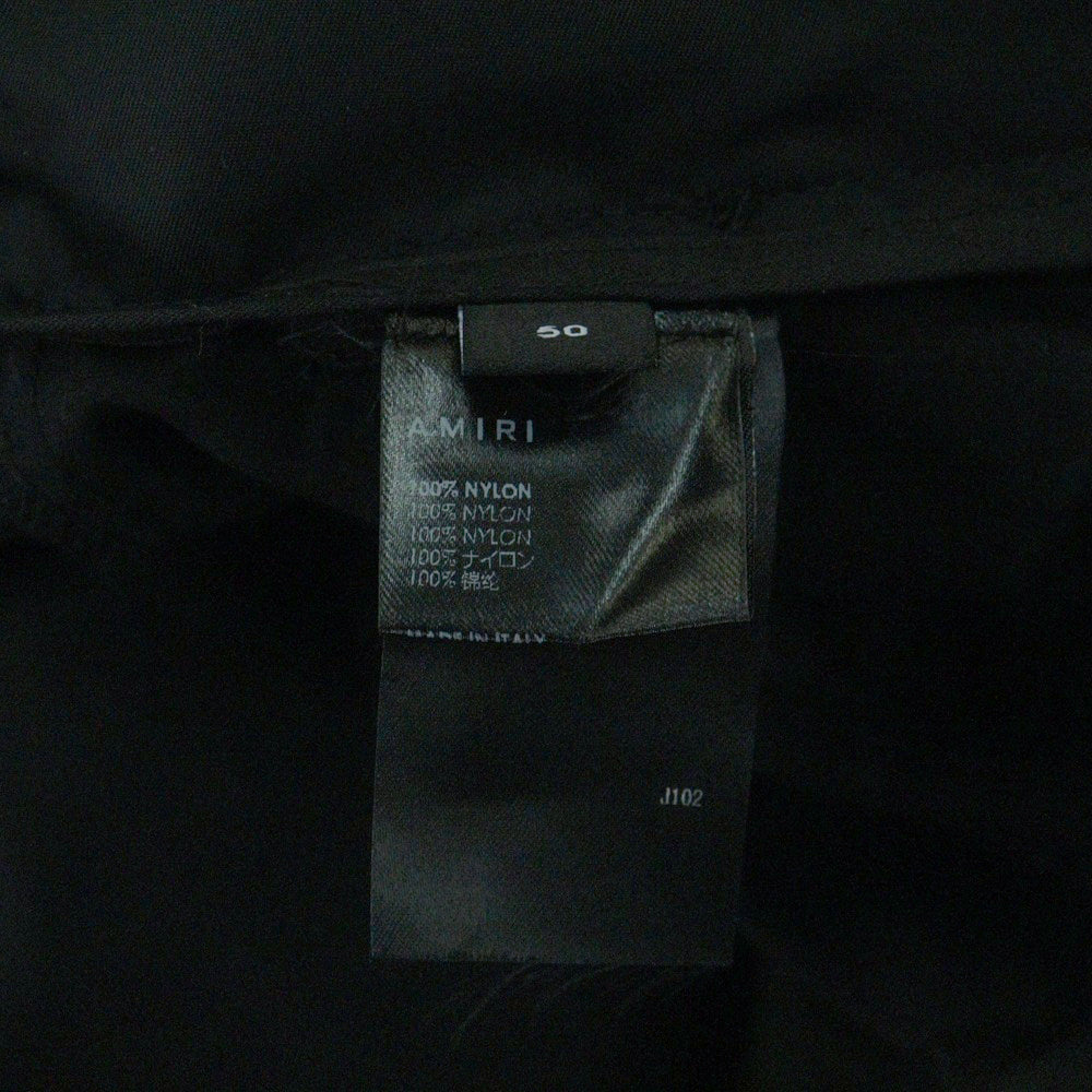 AMIRI(アミリ) PARACHUTE PANTS フロントロゴ刺繍 ナイロン ワイド パラシュートパンツ ブラック PF22MPF006
