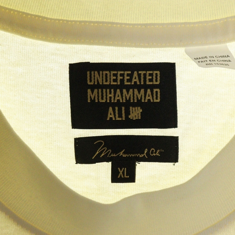 UNDEFEATED(アンディフィーテッド) 24SS ×MUHAMMAD ALI モハメド アリ クルーネック半袖プリントTシャツ カットソー アイボリー UC42GSS14M