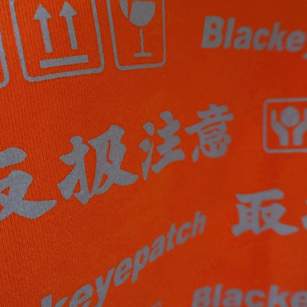 THE BLACK EYE PATCH(ブラックアイパッチ) HANDLE WITH CARE ZIP HOODIE ハンドル ウィズ ケア ジップアップスウェットパーカー フーディー オレンジ