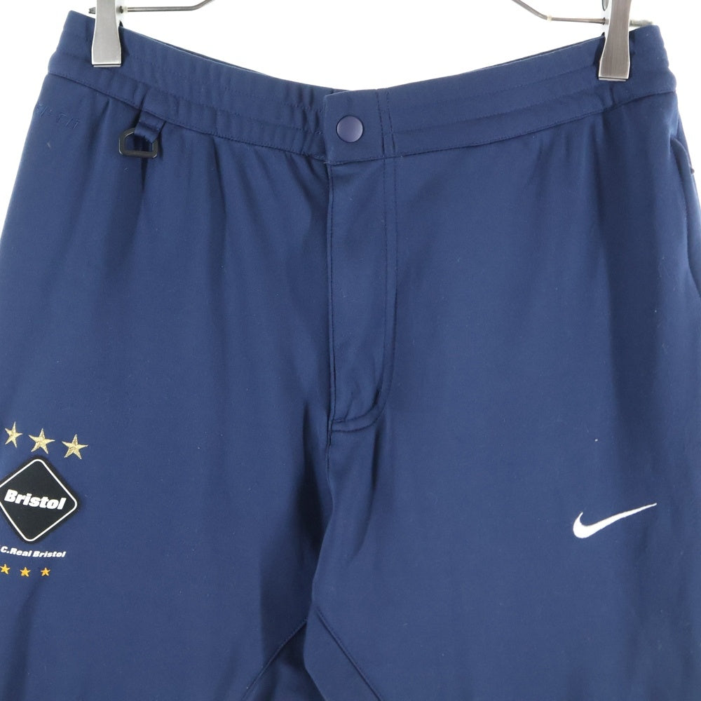 F.C.R.B./F.C.Real Bristol/FCRB(エフシーアールビー/エフシーレアルブリストル) ×NIKE DRI-FIT WARM UP PANTS ナイキ ドライフィット フロントロゴワッペン ウォームアップパンツ ネイビー 716118-450