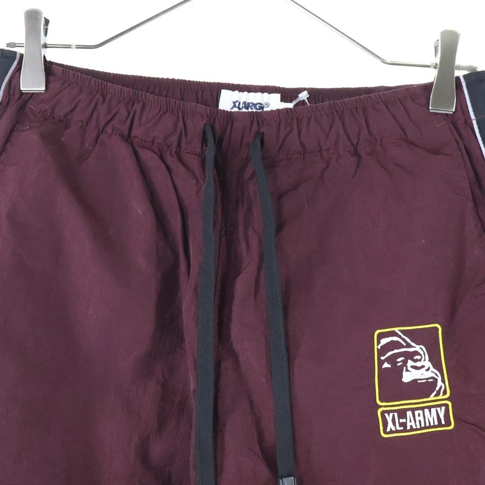 X-LARGE(エクストララージ) TRACK PANT サイドライン ドローストリング ナイロン トラックパンツ バーガンディー 01183606