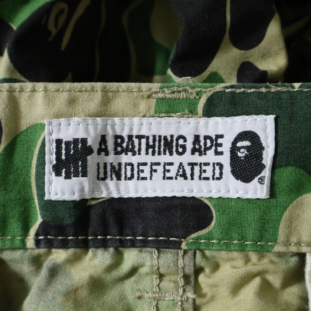 A BATHING APE(アベイシングエイプ) ×UNDEFEATED ABC 6POCKET PANTS アンディフィーテッド ABCカモ柄 総柄 マルチポケット ジップアップ カーゴパンツ グリーン 001PTE231903X