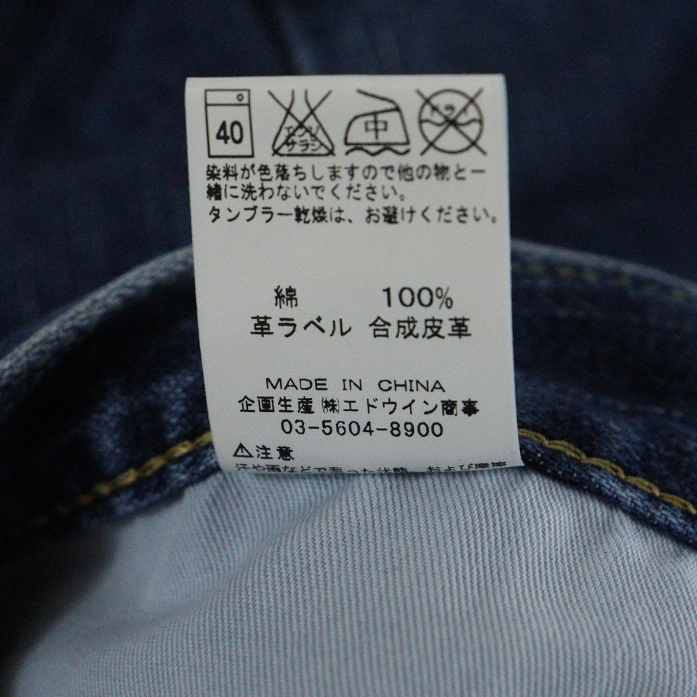 Wrangler(ラングラー) ブラウンロゴパッチ ボタンフライ ストレートデニムパンツ インディゴ W0383