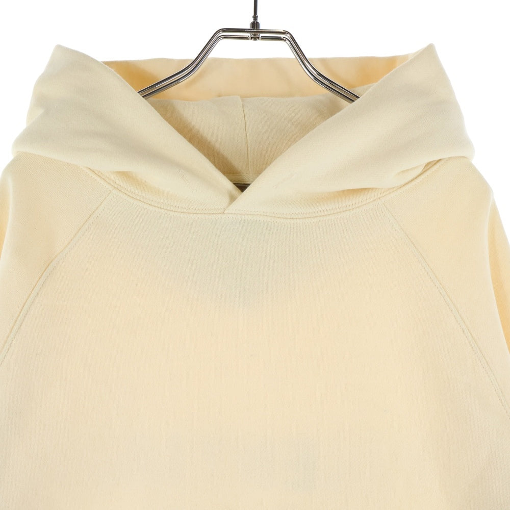 ESSENTIALS FEAR OF GOD(エッセンシャル フィアオブゴッド) バックロゴプリント プルオーバーパーカー アイボリー