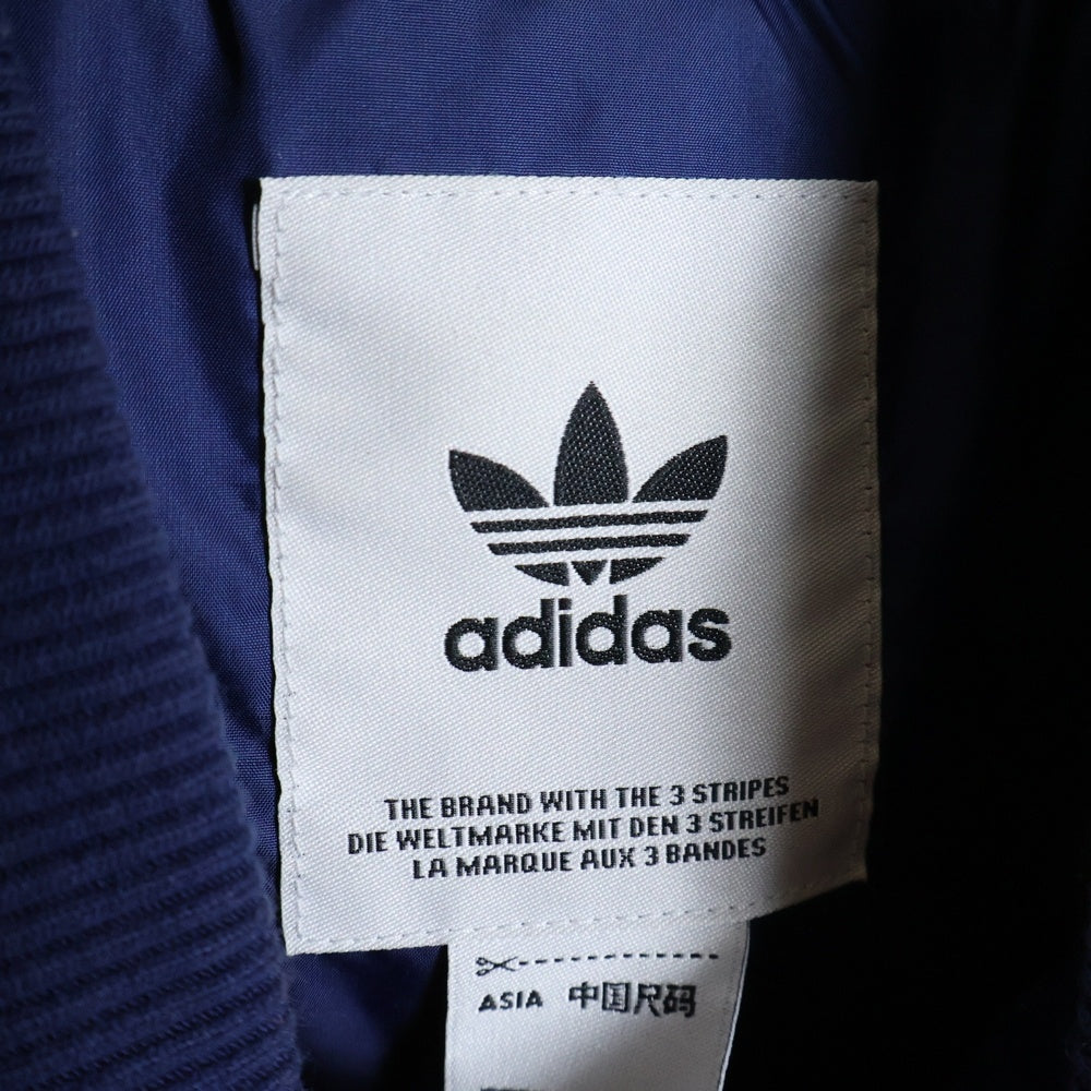 adidas(アディダス) SST VARSITY トレフォイルロゴパッチ スタジャン ジャケットブルゾン ブルー/ホワイト IL2574