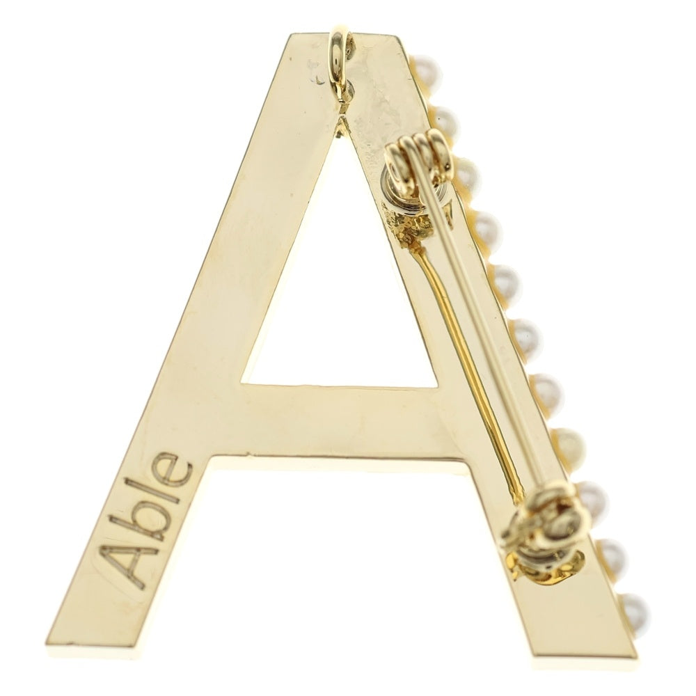 STELLAR HOLLYWOOD(ステラハリウッド) パールドット イニシャルブローチ ゴールド レディース