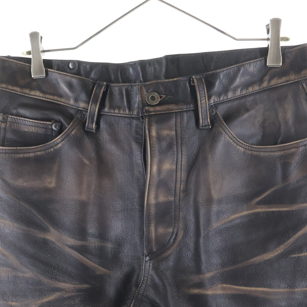 ISAMU KATAYAMA BACKLASH(イサムカタヤマバックラッシュ) 25SS 茶芯ジャパンステアヴィンテージ加工 ボタンフライカウレザーパンツ 2144-01