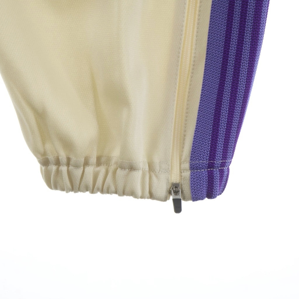 Needles(ニードルス) 23SS SPECIAL ZIPPED TRACK PANT スペシャル 裾ジッパー パピヨン刺繍 トラックパンツ ベージュ/パープル MR414
