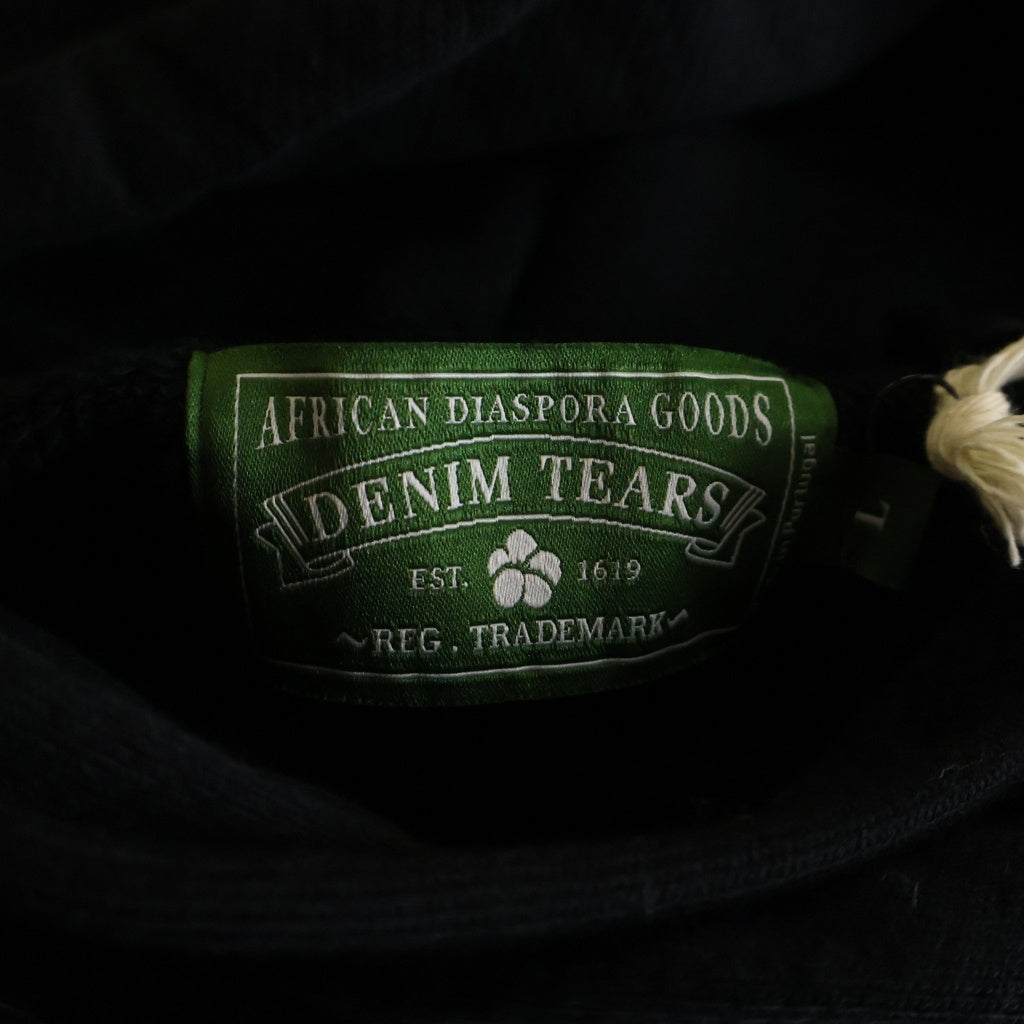 DENIM TEARS(デニムティアーズ) CORE JUMBO WREATH HOODIE コアー ジャンボ リース 両面プリント プルオーバーパーカー フーディー ブラック SS25THD063