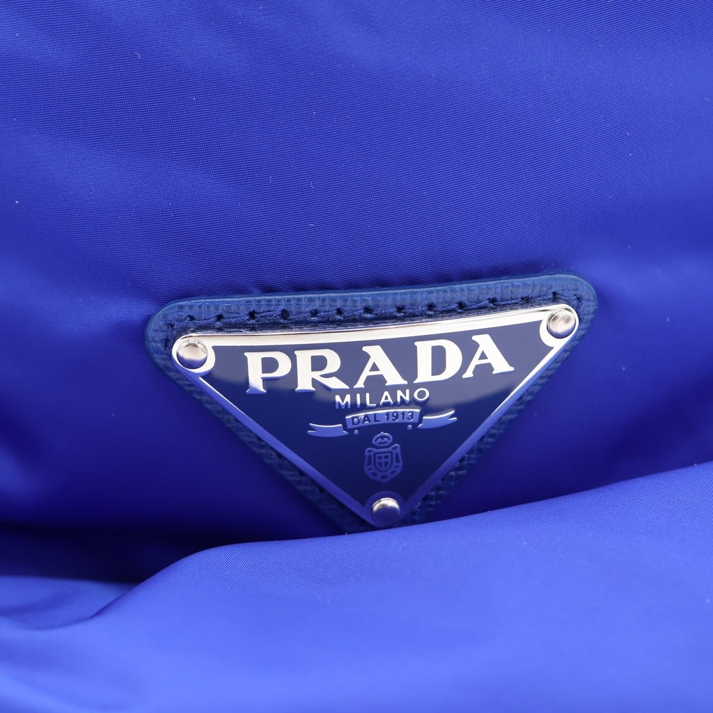 PRADA(プラダ) トライアングルロゴプレート ナイロン パテッド バケットハット 帽子 ブルー 2HC248 レディース