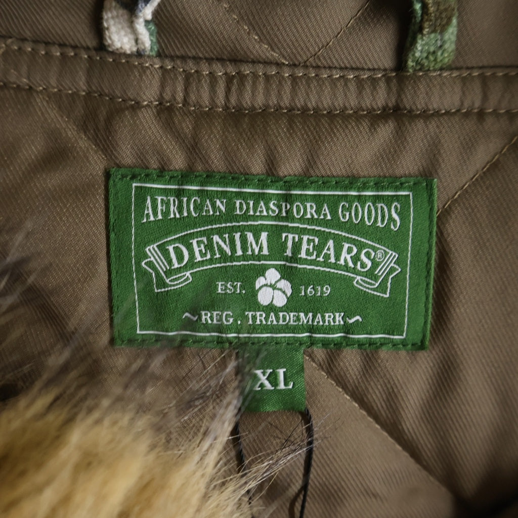 DENIM TEARS(デニムティアーズ) 26SS CAMO WORK JACKET カモ柄 ファーフーデッドワークジャケット カーキ SS26OLJ1356