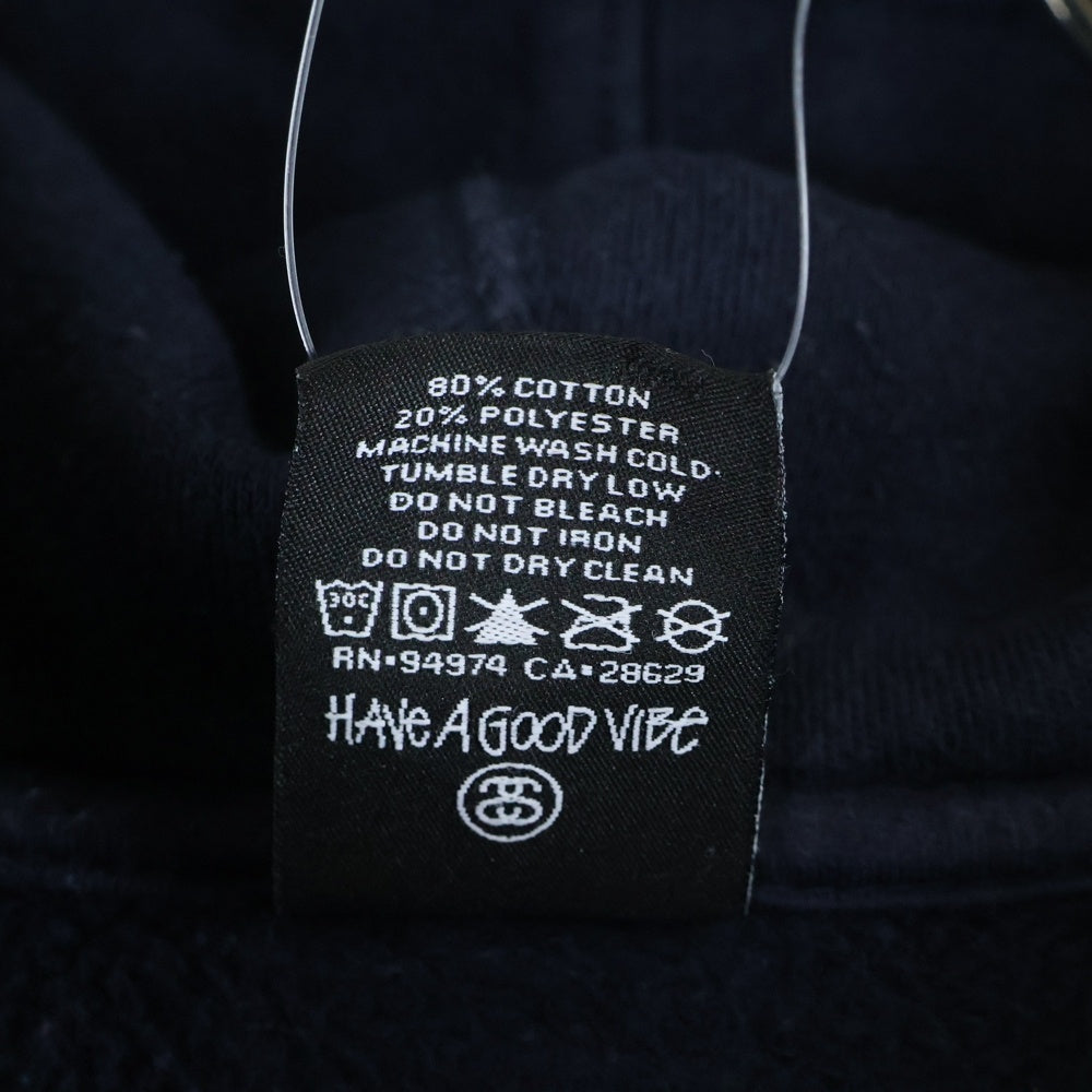 STUSSY(ステューシー) バックスカルプリント ジップアップコットンパーカー ブラック