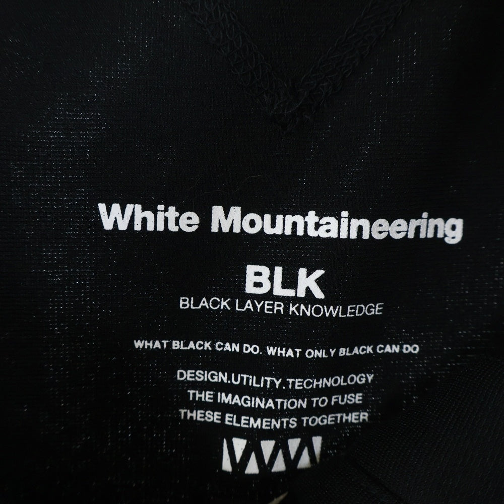 White Mountaineering(ホワイトマウンテニアリング) 24SS ラグランスリーブ スタンドカラー アシンメトリー ジップアップ トラックジャケット ジャージ ブラック BK2471501BK2471501