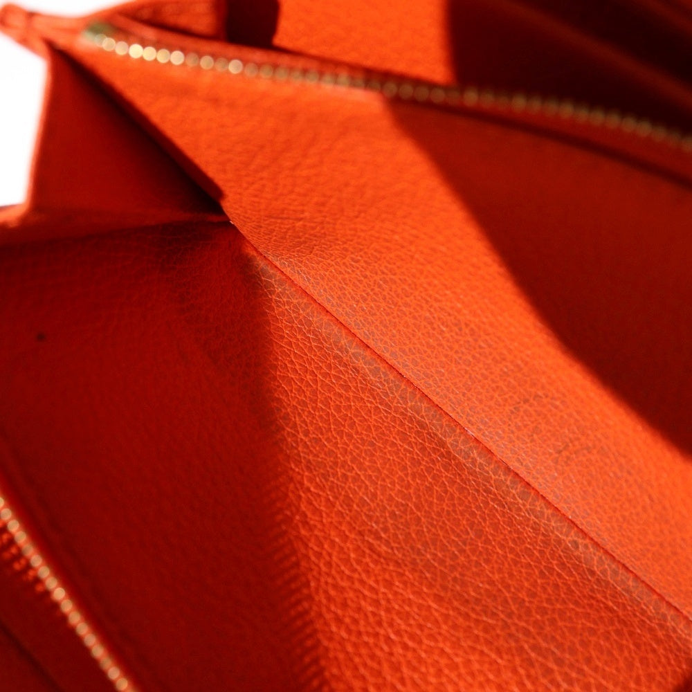 GUCCI(グッチ) ロゴエンボス ラウンドジップ レザー ロングウォレット 長財布 オレンジ 658691 レディース