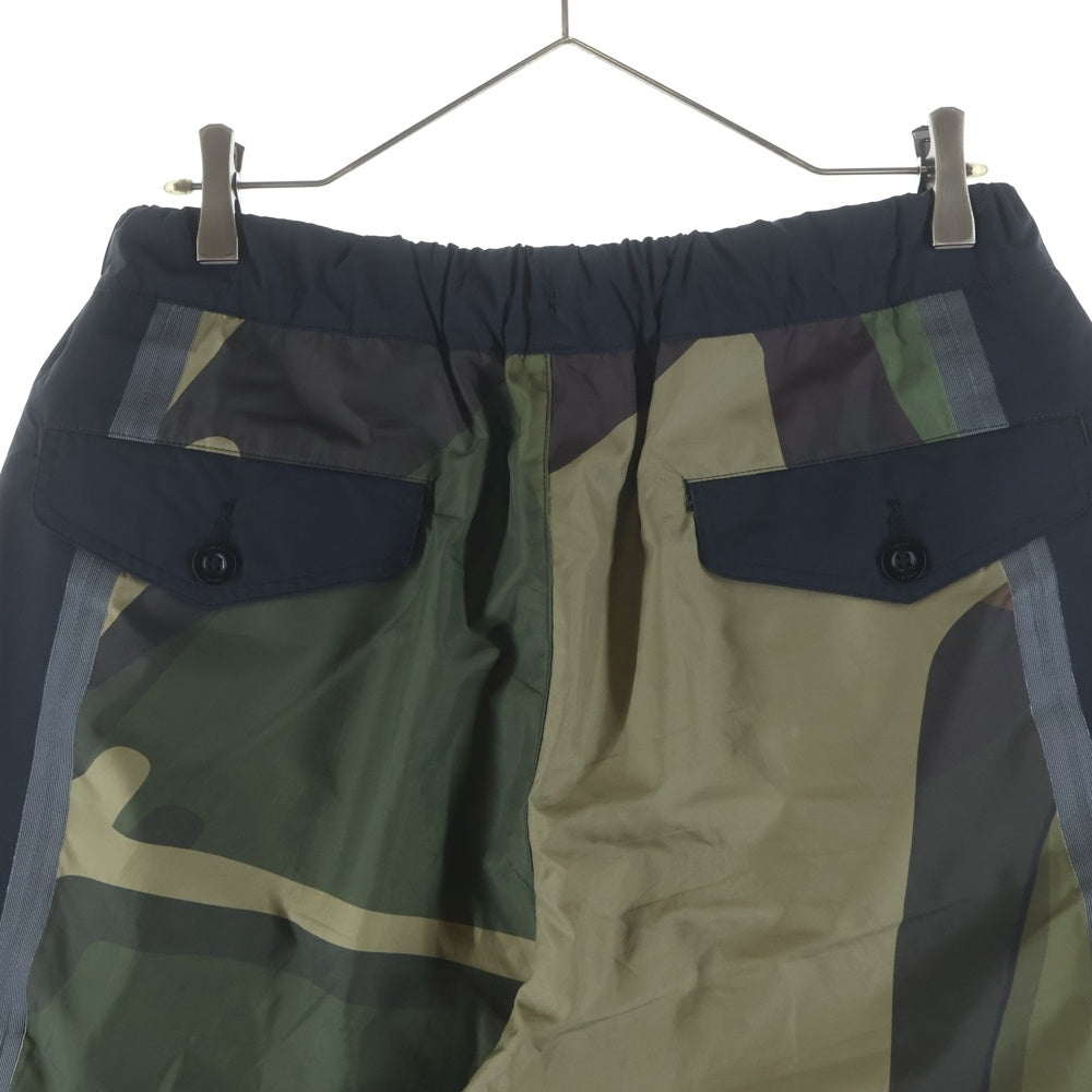 Sacai(サカイ) 21AW ×Kaws Trak Pants カウズ カモフラ トラックパンツ ブラック/カーキ 21-02568M