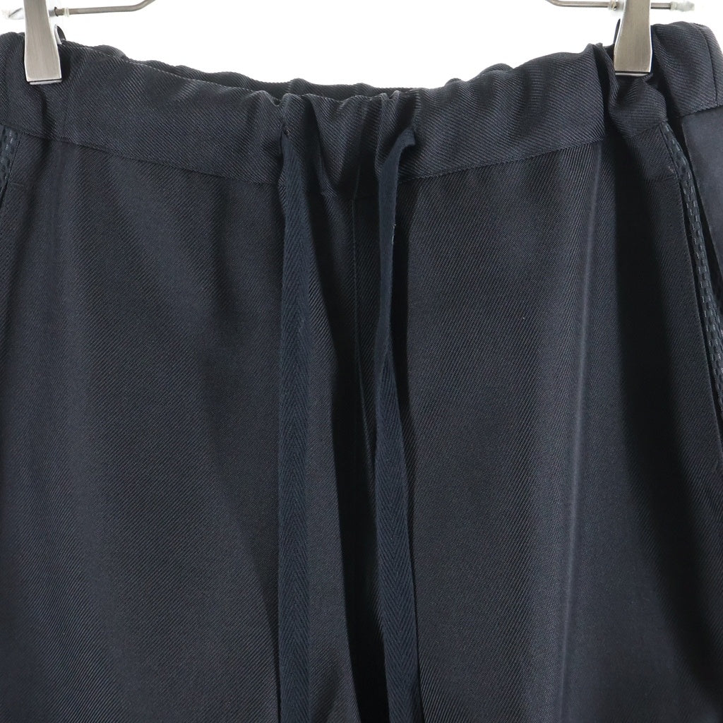 JUNYA WATANABE COMME des GARCONS(ジュンヤワタナベ コムデギャルソン) ウエストドローコード 裾ジップ エステルサイドライン ワイドトラックパンツパンツ ブラック