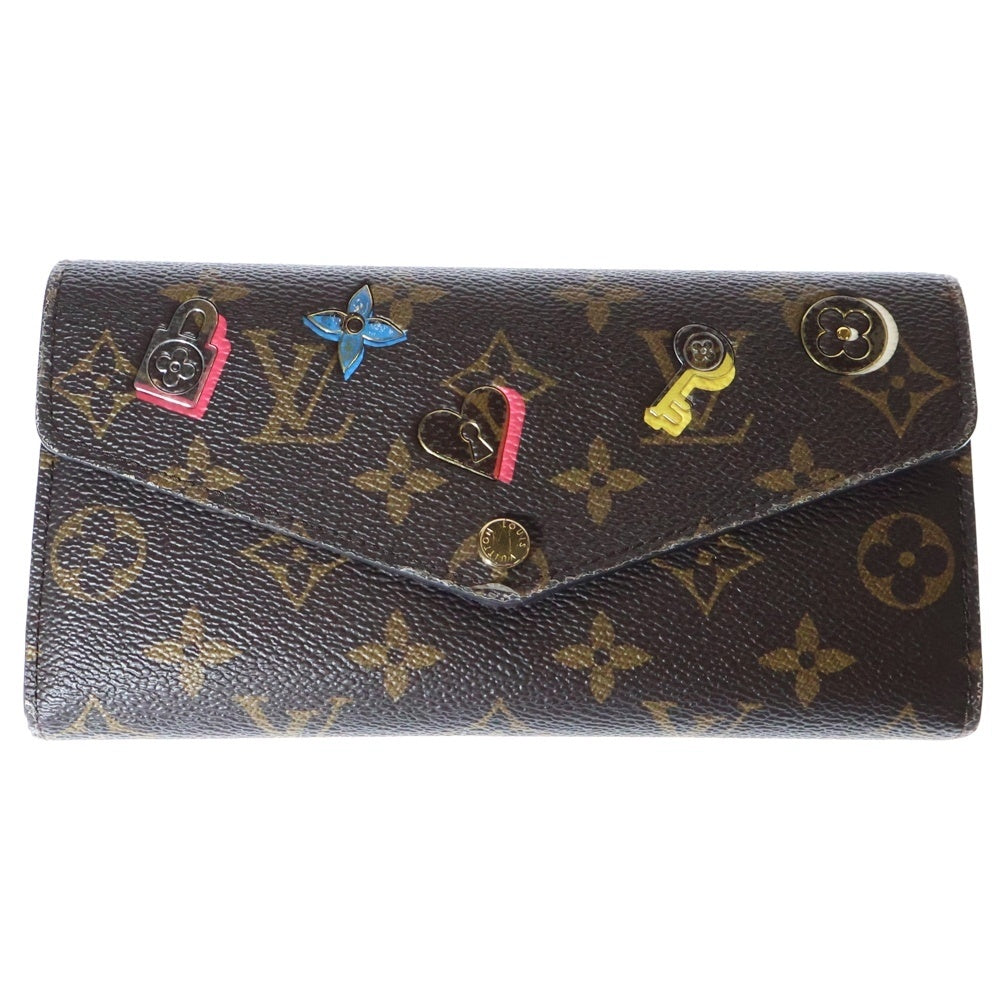 LOUIS VUITTON(ルイヴィトン) モノグラム ポルトフォイユ サラ ラブ ロック ロングウォレット 長財布 ブラウン ゴールド金具 PVC M64117