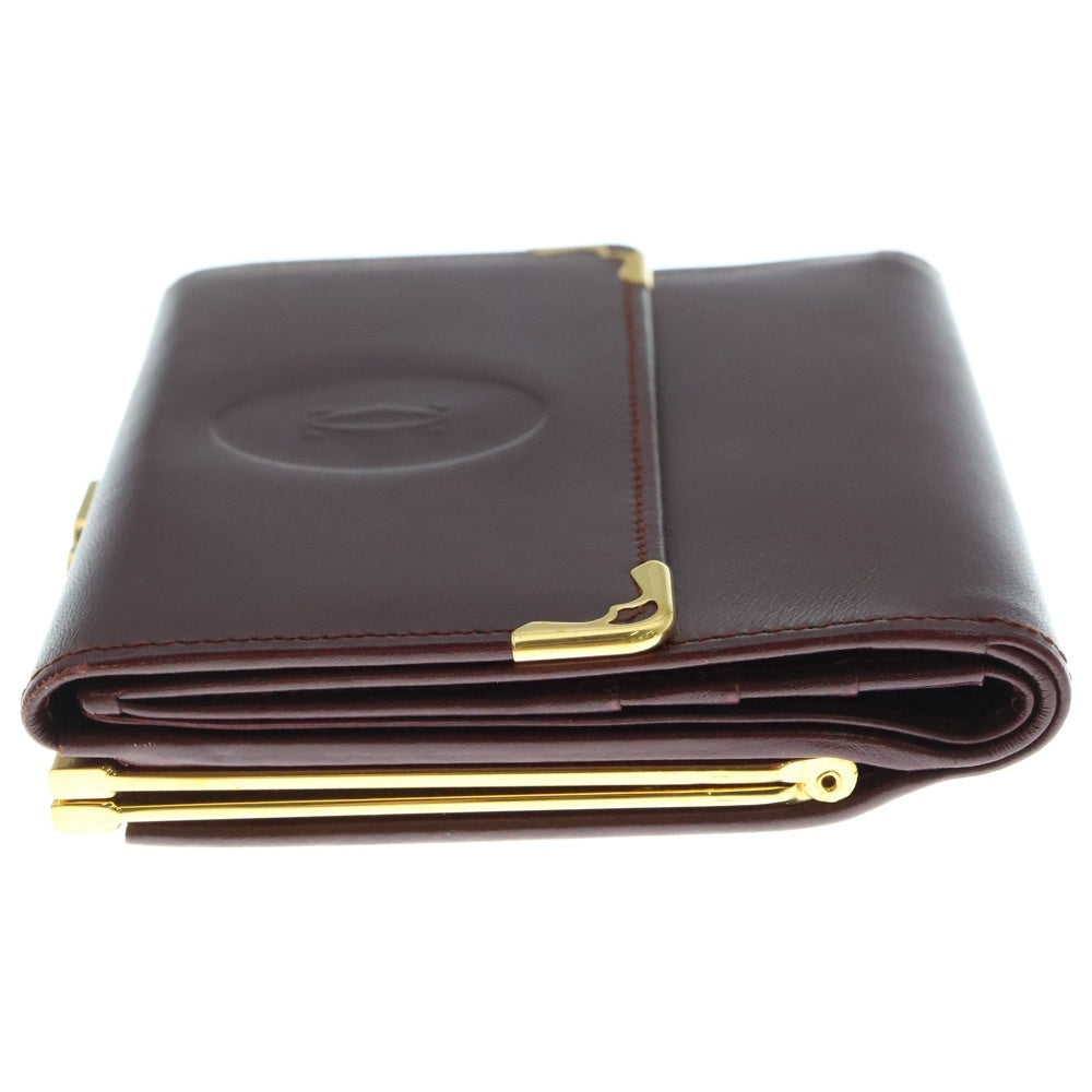 Cartier(カルティエ) エンボスロゴ カーフレザー がま口 コンパクトウォレット 二つ折り財布 ゴールド金具 ボルドー 〇