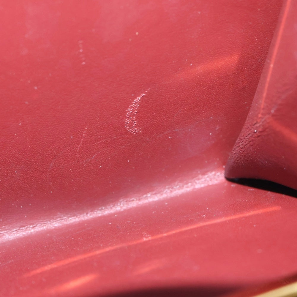 Cartier(カルティエ) エンボスロゴ カーフレザー がま口 コンパクトウォレット 二つ折り財布 ゴールド金具 ボルドー 〇