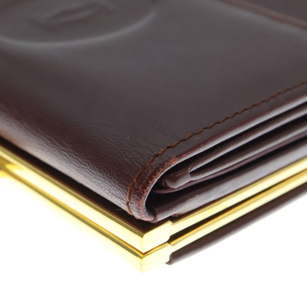 Cartier(カルティエ) エンボスロゴ カーフレザー がま口 コンパクトウォレット 二つ折り財布 ゴールド金具 ボルドー 〇
