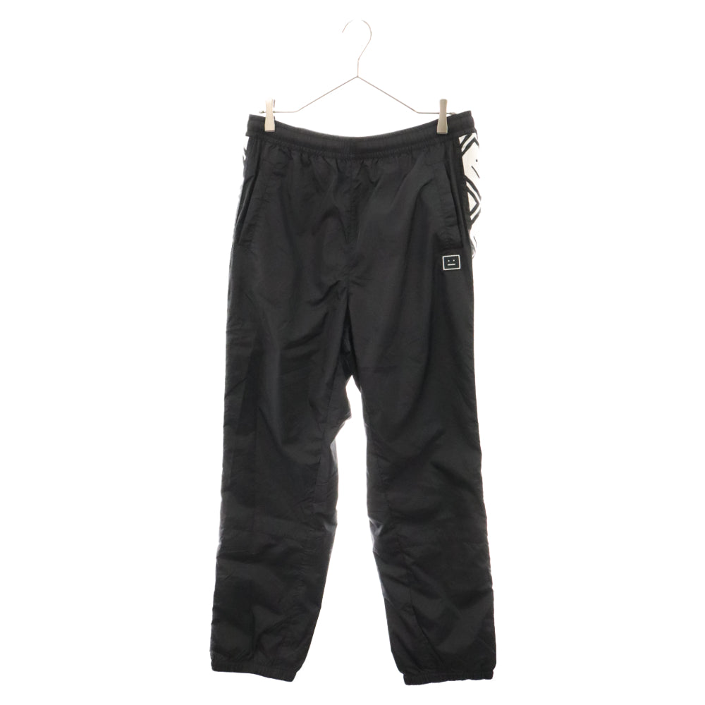Acne Studios(アクネ ストゥディオズ) Face Motif Side Stripe Track Pants フェイスロゴサイドテープトラックパンツ FA-UX-TROU000014 ブラック