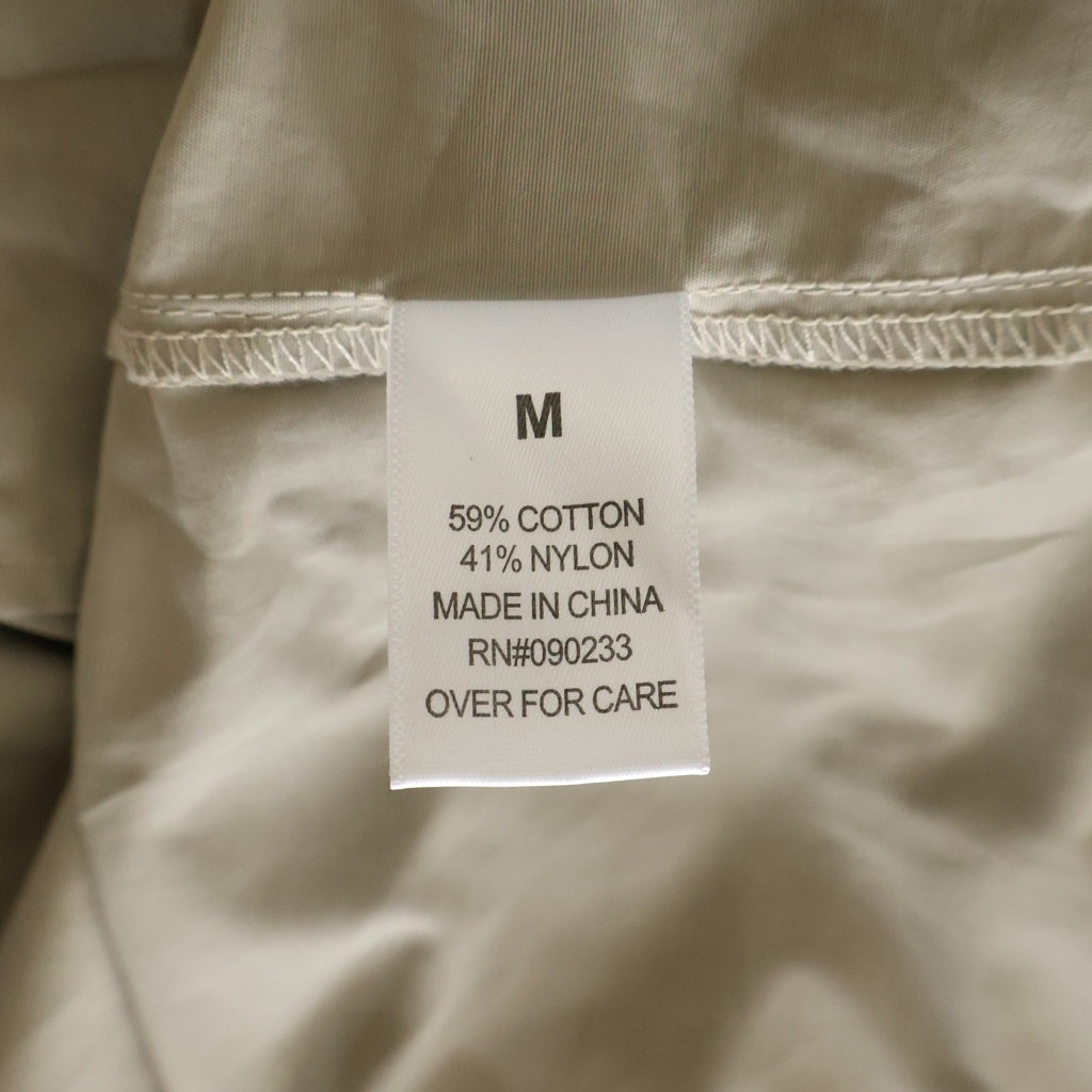 FEAR OF GOD ESSENTIALS(フィアオブゴッド エッセンシャルズ) HALF ZIP NYLON JACKET リフレクターロゴ ハーフジップ ナイロントラックジャケット ベージュ