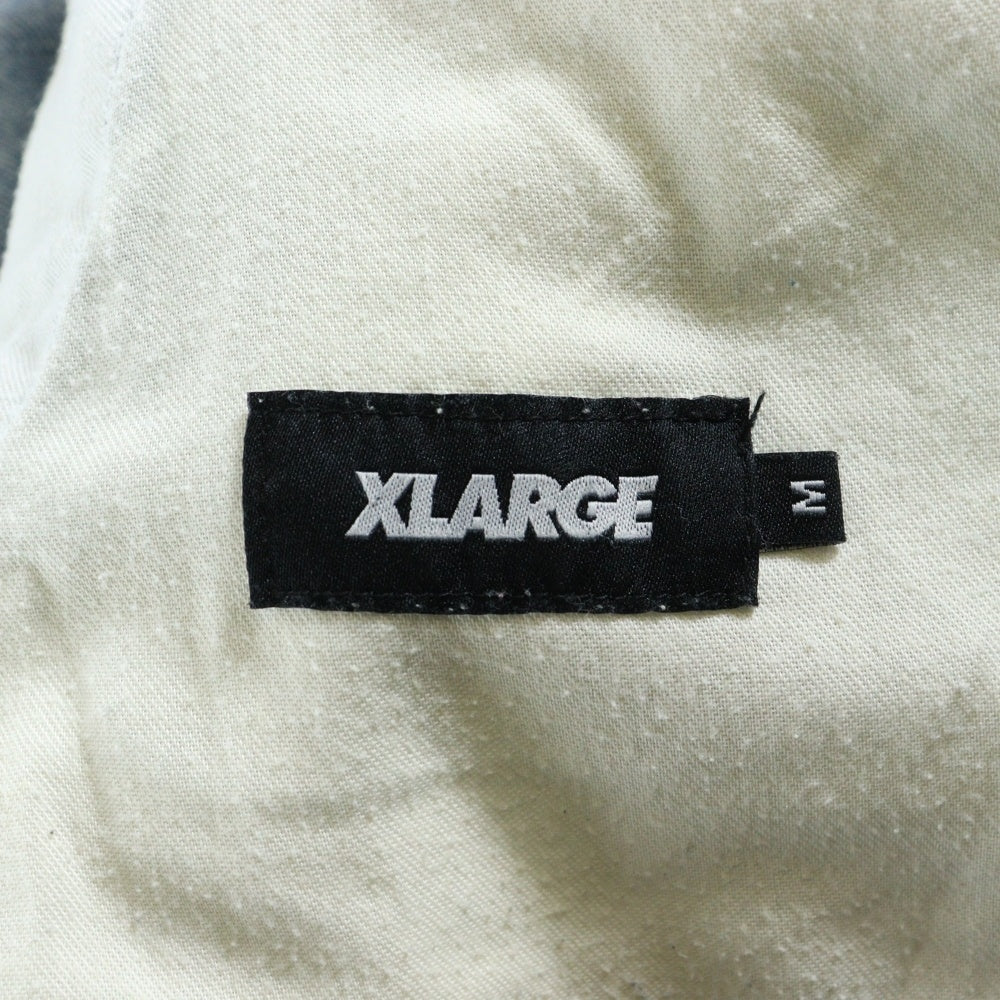 X-LARGE(エクストララージ) 23AW EASY DENIM PANTS ダメージ加工 フロントデザイン イージーデニムパンツ ジーンズ インディゴ 101233031025