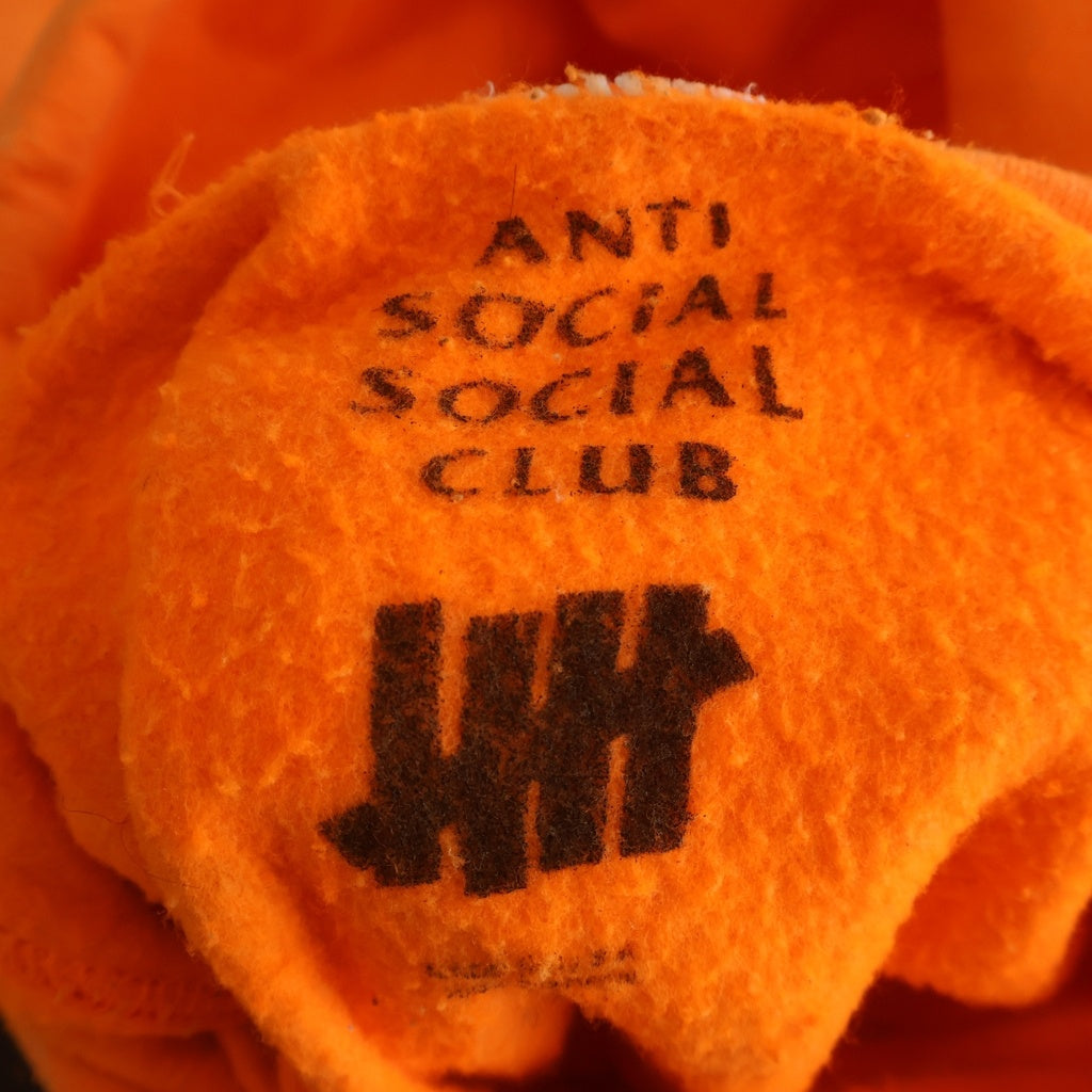 ANTI SOCIAL SOCIAL CLUB(アンチソーシャルソーシャルクラブ) ×Undefeated Still Paranoid Hoodie アンディフィーティド 両面プリント プルオーバーパーカー フーディ オレンジ