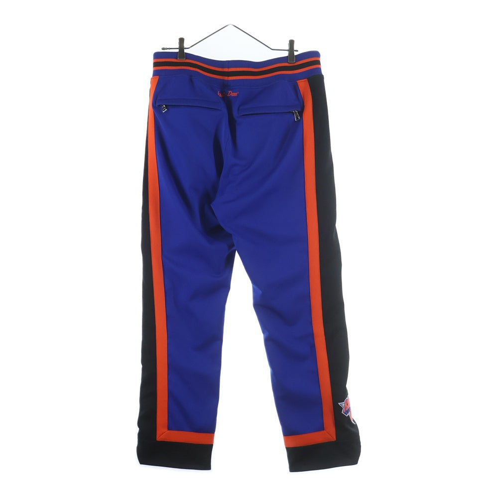 JUSTDON(ジャストドン) Mitchell & Ness NBA New York Knicks ミッチェル&ネス ニューヨークニックス ロゴワッペン トラックパンツ ジャージ ブルー/オレンジ