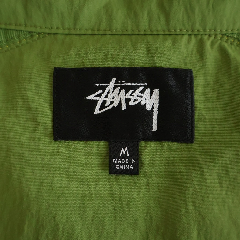 STUSSY(ステューシー) バックロゴプリント サイドライン ジップアップ ナイロン トラックジャケット グリーン レディース