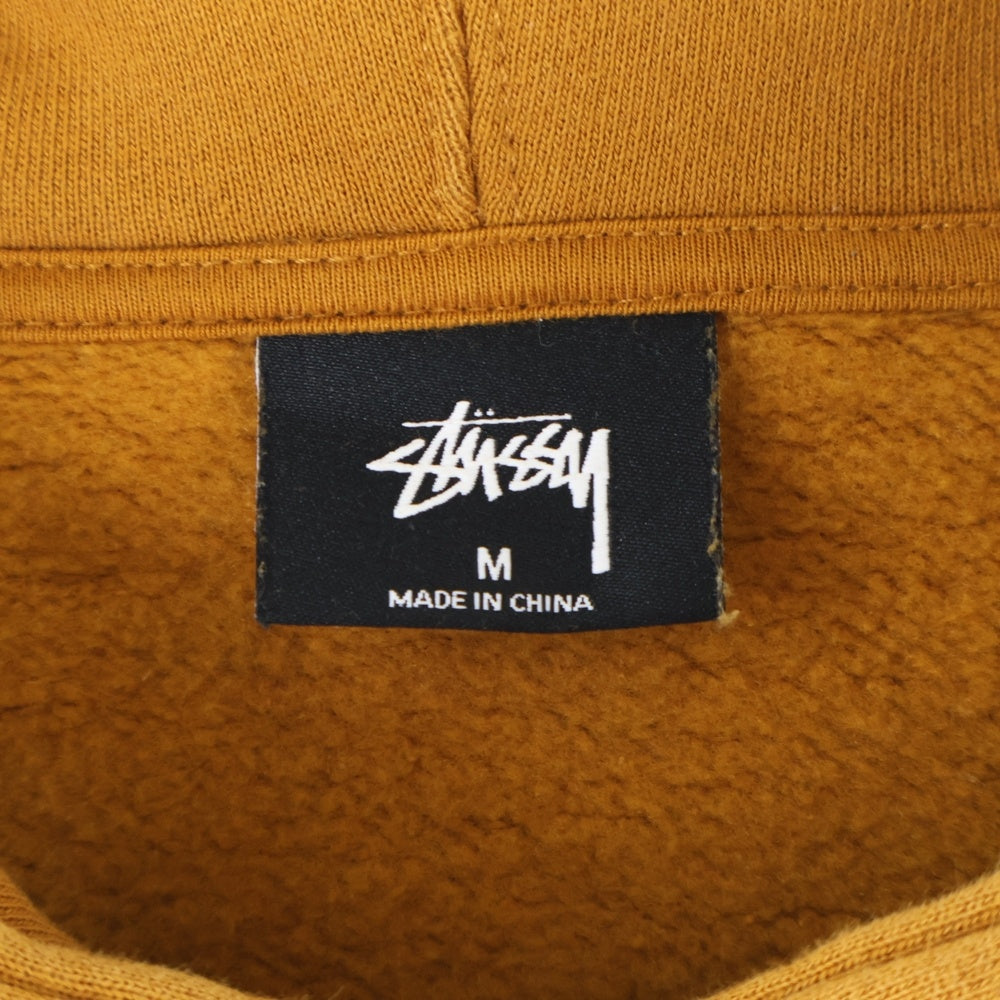 STUSSY(ステューシー) オレンジ プリント プルオーバーフーディーパーカー ブラウン