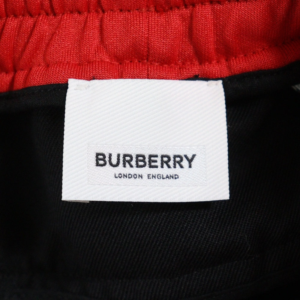 BURBERRY バーバリー ダブルウエスト サイドラインデザイン トラックパンツ レイヤードジョガーパンツ ブラック/レッド BURBERRY(バーバリー) ダブルウエスト サイドラインデザイン トラック