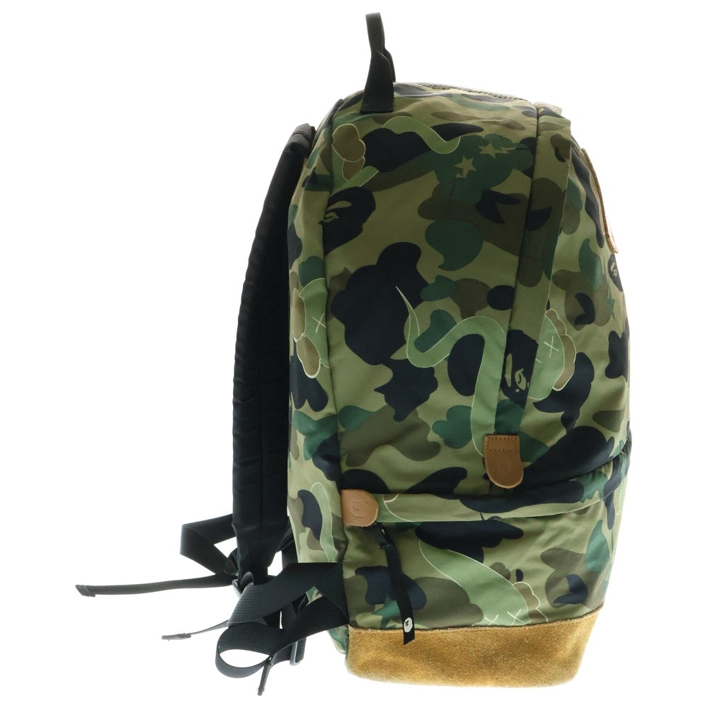 A BATHING APE(アベイシングエイプ) ×KAWS bendy 1st camo green APE HEAD backpack ×カウズ ベンディー ファーストカモエイプヘッド総柄バックパックリュック グリーン